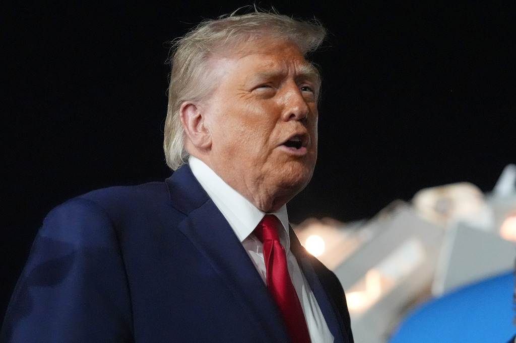 President Donald Trump talks with reporters before boarding Air Force One at John F. Kennedy International Airport in New York, early Tuesday, June 9, 2026. (AP Photo/Mark Schiefelbein)