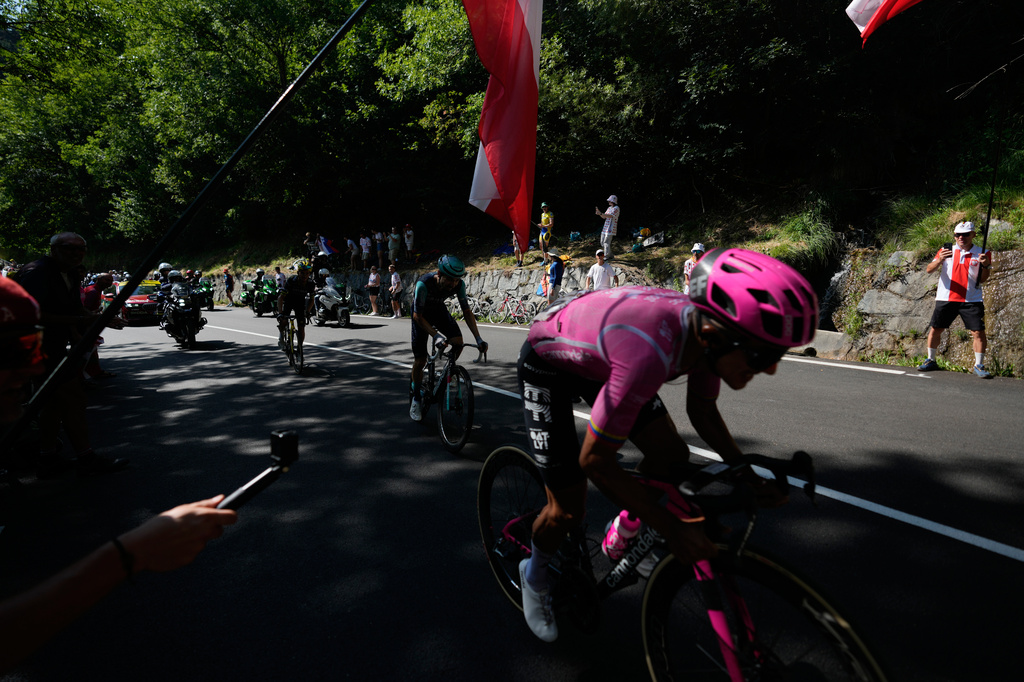 Ecuador's Richard Carapaz climbs Alpe d'Huez during the nineteenth stage of the Tour de France cycling race with start in Gap and finish in Alpe d'Huez, France, Friday, July 24, 2026. (AP Photo/Mosa'ab Elshamy)
