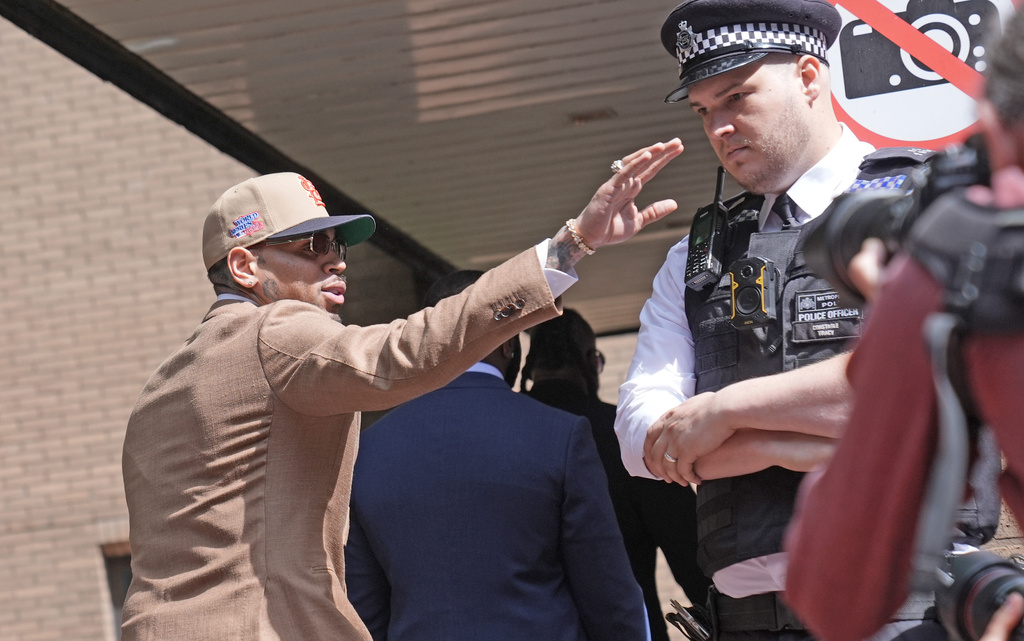 Chris Brown arrives at Southwark Crown Court, where he is charged over an alleged assault in a London nightclub, in London, Friday, July 24, 2026. (Stefan Rousseau/PA via AP)