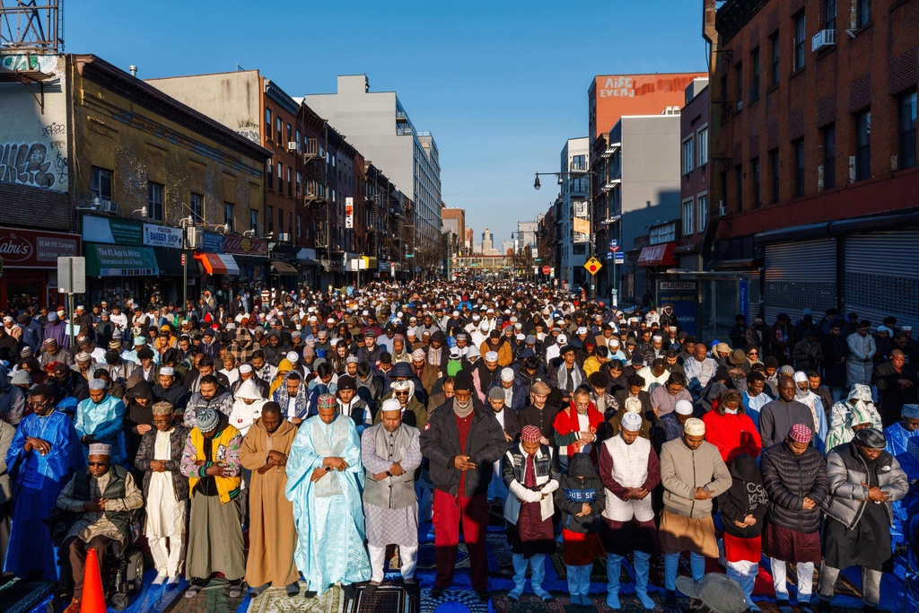 Muslim worshippers attend Eid al-Fitr prayer, Friday, March 20, 2026 in the Brooklyn Borough of New York. (AP Photo/Adam Gray)