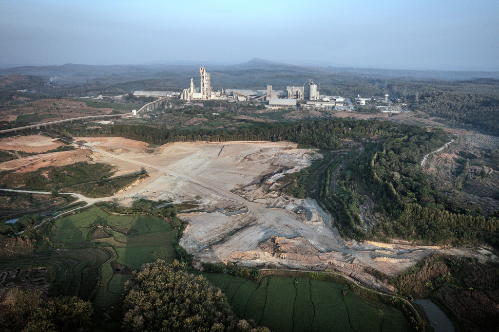 A clay mine is seen near a cement factory in Kendeng Mountains in Rembang, Central Java, Indonesia, Friday, June 19, 2026. (AP Photo/Ibrahim AS) CORRECTION: Corrects to clay mine