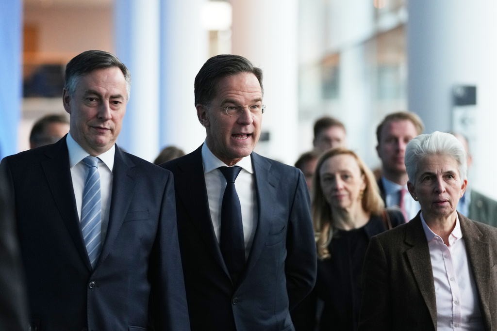 NATO Secretary General Mark Rutte, second left, arrives to address the Security and Defence Committee at the European Parliament in Brussels, Monday, Jan. 26, 2026. (AP Photo/Virginia Mayo)