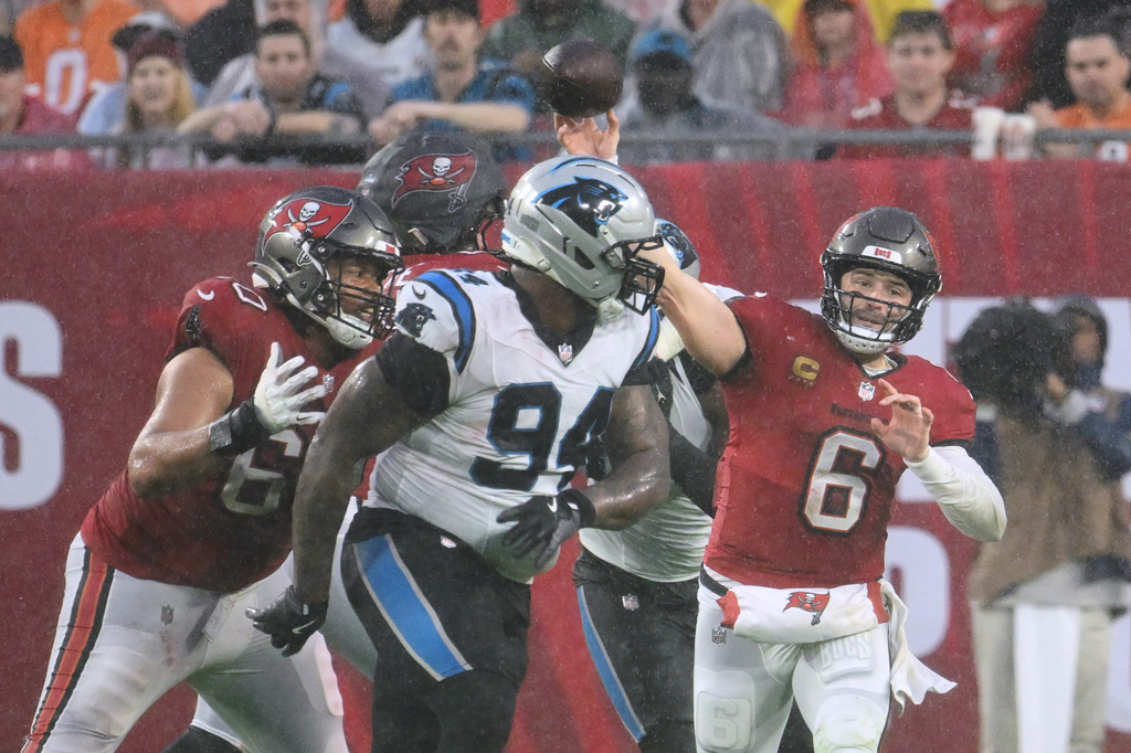 Tampa Bay Buccaneers quarterback Baker Mayfield (6) throws an interception during the first half of an NFL football game against the Carolina Panthers Saturday, Jan. 3, 2026, in Tampa, Fla. (AP Photo/Jason Behnken)