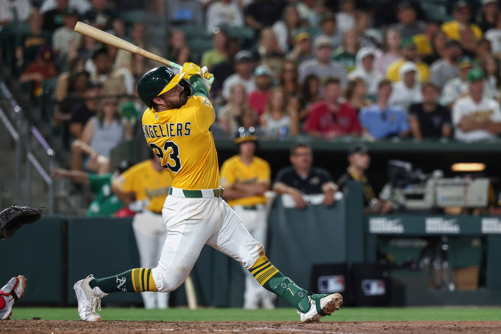 Athletics' Shea Langeliers hits a three-run double during the seventh inning of a baseball game against the Washington Nationals Saturday, July 18, 2026, in West Sacramento, Calif. (AP Photo/Sara Nevis)