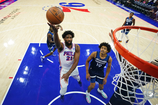 Philadelphia 76ers' Joel Embiid (21) goes up for a shot past Minnesota Timberwolves' Joan Beringer (19) during the first half of an preseason NBA basketball game Friday, Oct. 17, 2025, in Philadelphia. (AP Photo/Matt Slocum) Philadelphia 76ers' Joel Embiid (21) goes up for a shot past Minnesota Timberwolves' Joan Beringer (19) during the first half of an preseason NBA basketball game Friday, Oct. 17, 2025, in Philadelphia. (AP Photo/Matt Slocum)