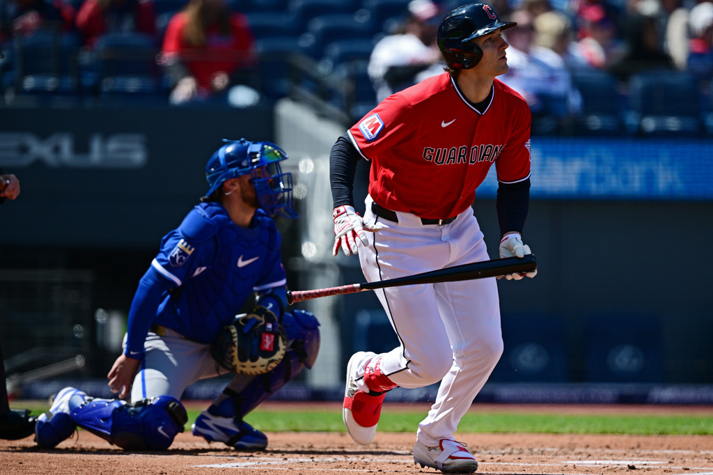 Cleveland Guardians' Chase DeLauter watches his ball after hitting a two-run double off Kansas City Royals starting pitcher Cole Ragans during the first inning of a baseball game, Wednesday, April 8, 2026, in Cleveland. (AP Photo/David Dermer)