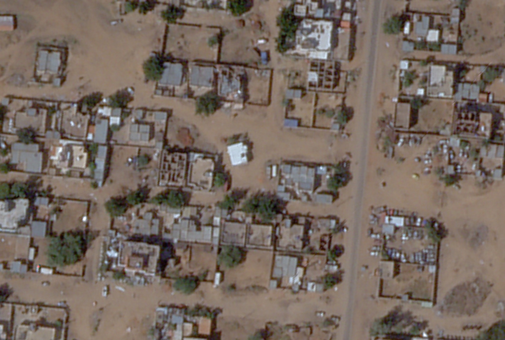 This satellite image by Planet Labs PBC shows a mosque, the center white building, and a discoloration in the soil just to the southeast of it after apparent digging there in the aftermath of an attack by the paramilitary Rapid Support Forces in el-Fasher, Sudan, Tuesday, Nov. 4, 2025. (Planet Labs PBC via AP)