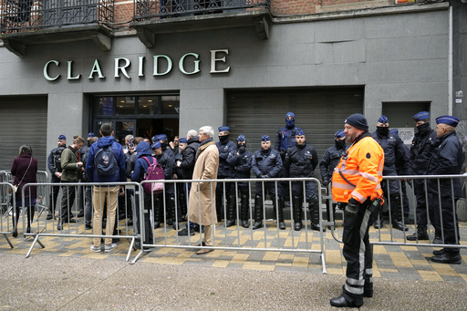Police guard outside the front entrance of the event venue as the National Conservatism conference takes place in Brussels, Tuesday, April 16, 2024. (AP Photo/Virginia Mayo)