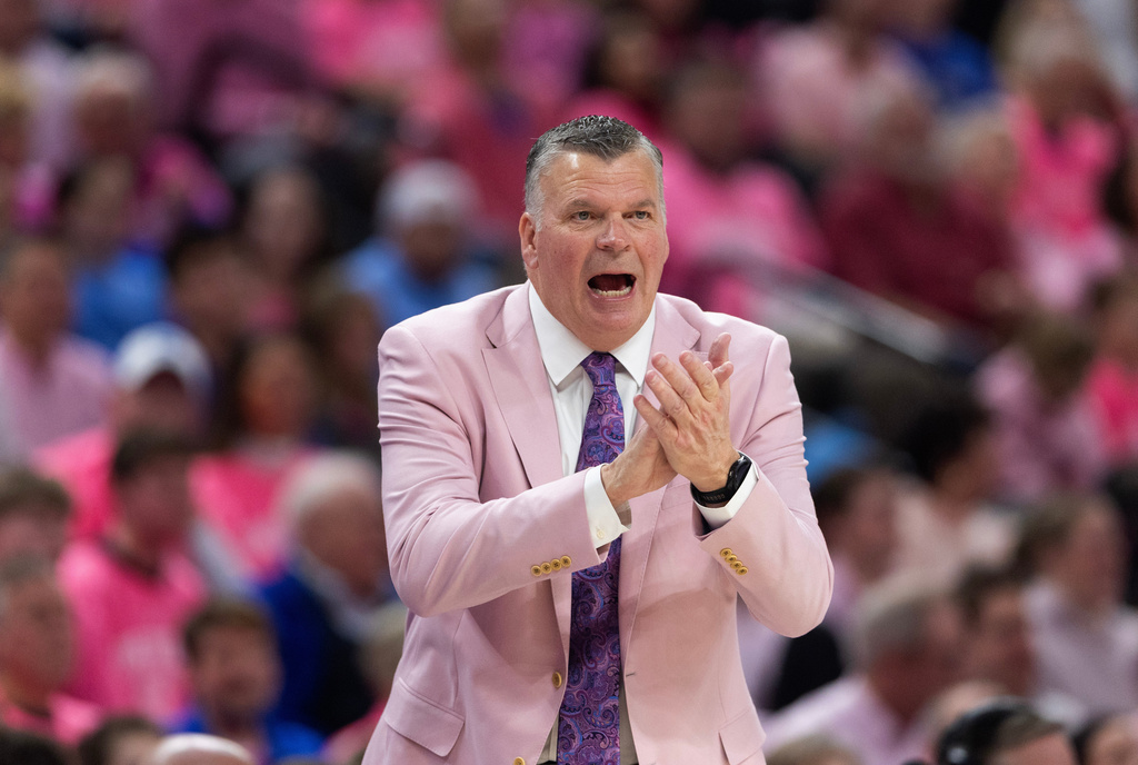 Creighton head coach Greg McDermott yells to his team as they play against UConn during the first half of an NCAA college basketball game Saturday, Jan. 31, 2026, in Omaha, Neb. (AP Photo/Rebecca S. Gratz)