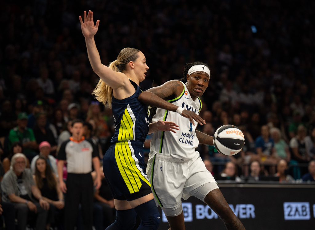 Minnesota Lynx forward Natasha Howard (1) drives against Dallas Wings guard Paige Bueckers (5) in the first half of a WNBA basketball game Tuesday, June 9 2026, in Minneapolis. (Jeff Wheeler/Minnesota Star Tribune via AP)