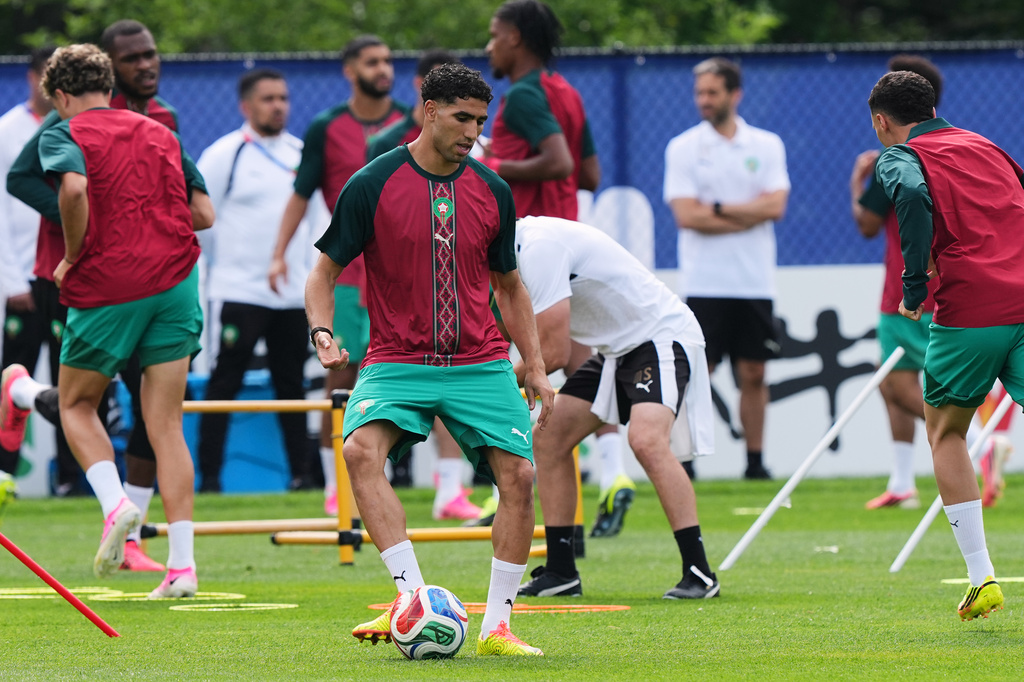 Morocco's Achraf Hakimi exercises during a training session ahead of the World Cup Group C soccer match between Scotland and Morocco in Foxborough, Mass., near Boston, Thursday, June 18, 2026. (AP Photo/Martin Meissner)