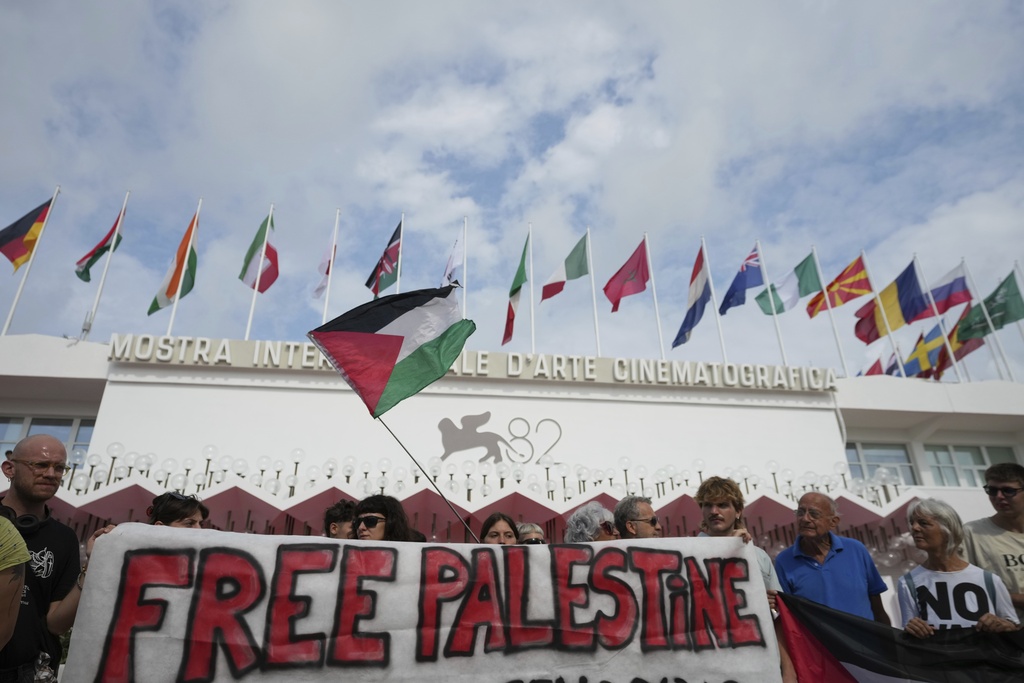 Pro Palestine demonstrators hold a press conference in front of the red carpet to announce a demonstration on Saturday, Aug. 30 during the 82nd edition of the Venice Film Festival in Venice, Italy, on Wednesday, Aug. 27, 2025. (Photo by Alessandra Tarantino/Invision/AP)
