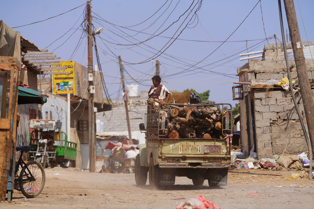 A truck loaded with firewood drives through the Al-Basateen neighborhood in Aden, Yemen, Tuesday, Oct. 13, 2026. (AP Photo/Abdulnasser Alseddik)