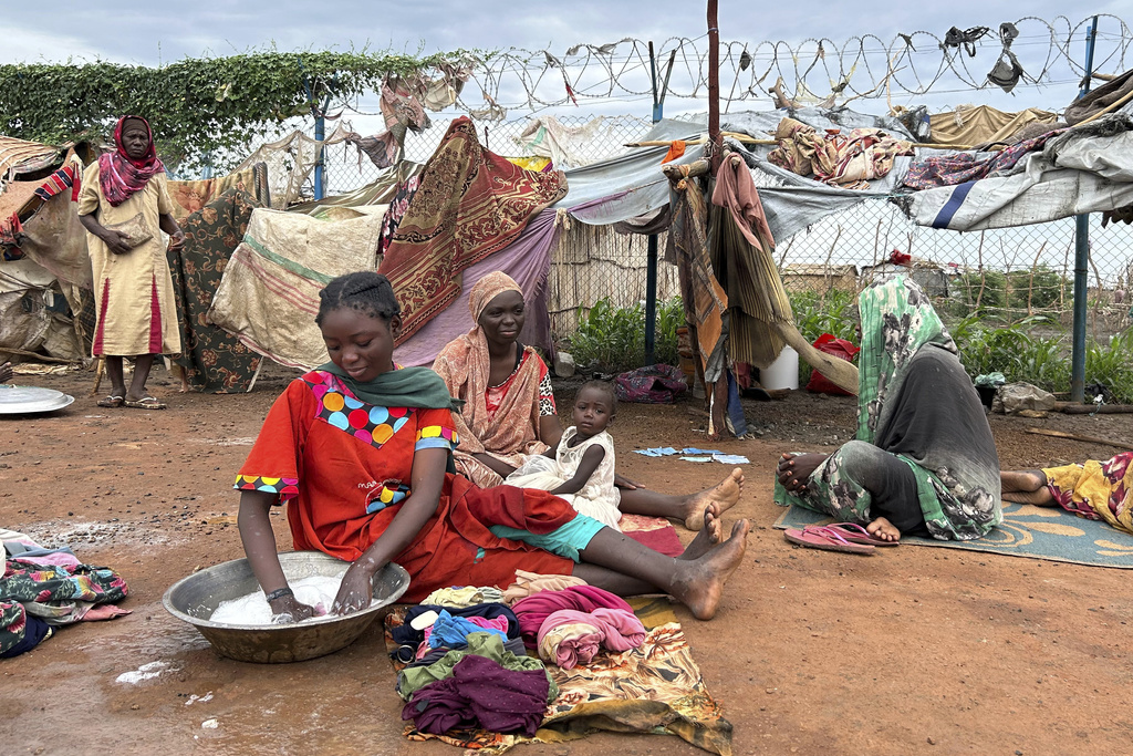 Women do laundry at the Renk transit center, which hosts more than 12,000 people fleeing the war in Sudan, in Renk, South Sudan, Saturday, Aug 9, 2025. (AP Photo/Adlai Coleman)