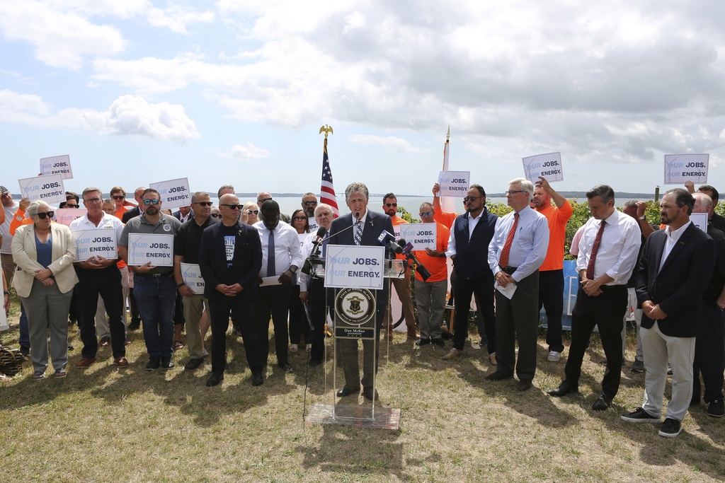 Rhode Island Gov. Dan McKee talks about the importance of the Revolution Wind offshore wind farm to the state's economy and energy future during a news conference in North Kingstown, R.I., on Monday, Aug. 25, 2025. (AP Photo/Jennifer McDermott)