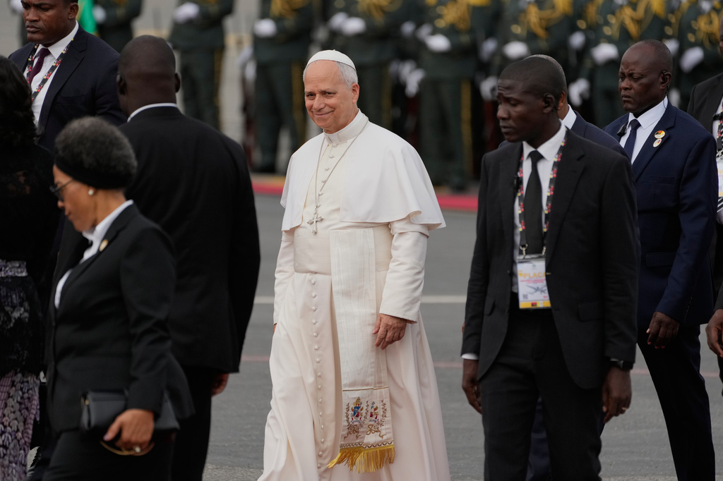Pope Leo XIV walks prior to his departure for Equatorial Guinea, in Luanda, Angola, Tuesday, April 21, 2026. (AP Photo/Themba Hadebe)