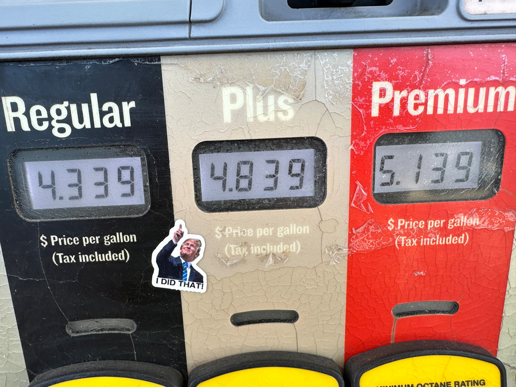 A sticker with the image of President Donald J. Trump points to the electronically-displayed per-gallon prices for the various grades of gasoline available from a pump at a Conoco station Saturday, May 30, 2026, in Denver. (AP Photo/David Zalubowski)