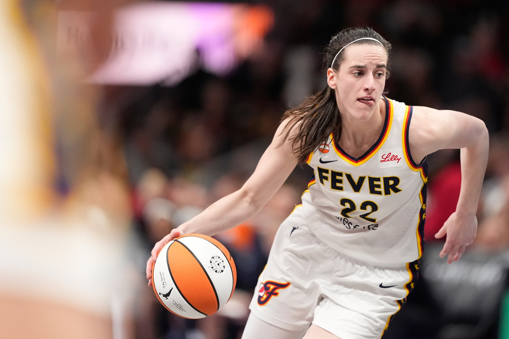 Indiana Fever guard Caitlin Clark (22) dribbles the ball in the second half of an WNBA basketball game against the Atlanta Dream Sunday, Aug. 16, 2026, in Atlanta. (AP Photo/Brynn Anderson)