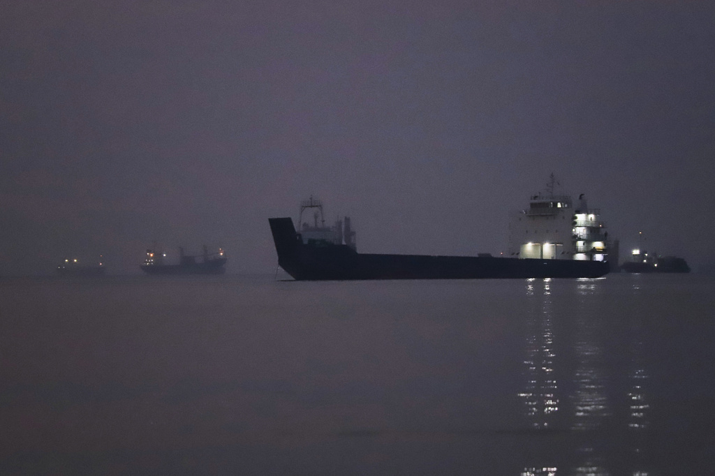 Cargo ships are anchored in the Strait of Hormuz off Bandar Abbas, Iran, before sunrise Monday, Sept. 28, 2026. (Amirhosein Khorgooi/ISNA via AP)