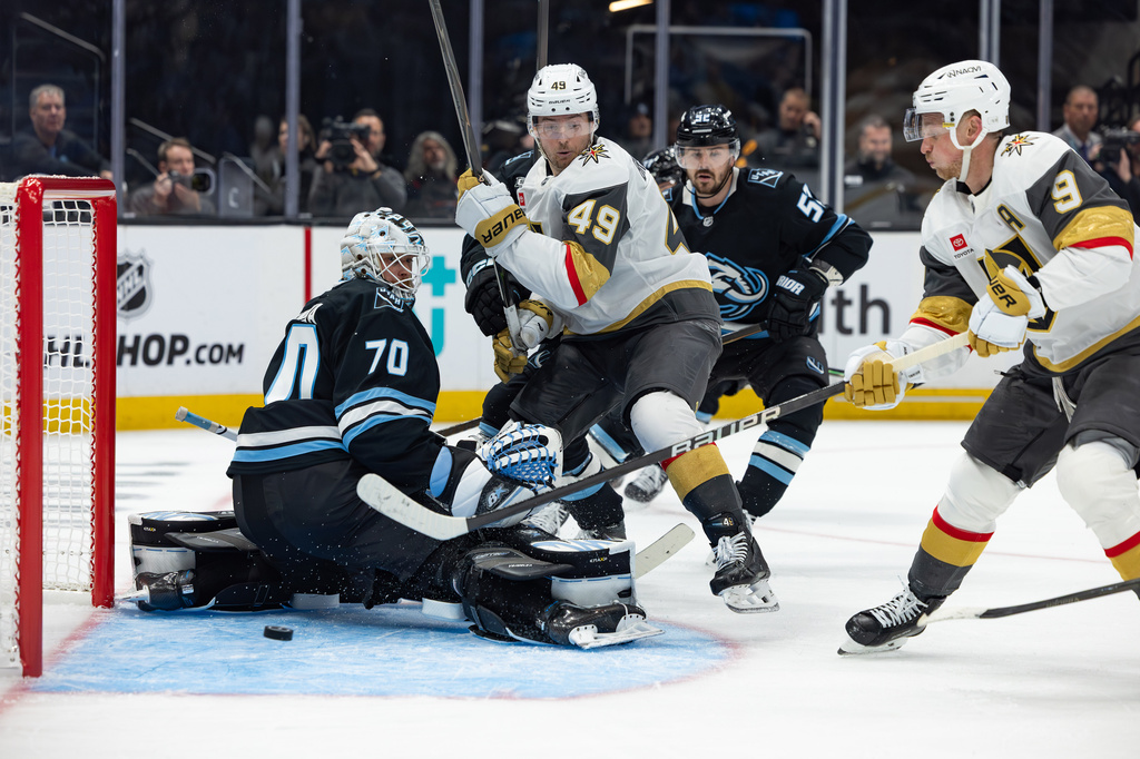 Vegas Golden Knights center Jack Eichel (9) scores against Utah Mammoth goaltender Karel Vejmelka (70) during the second period of Game 3 of the first round in an NHL hockey Stanley Cup playoff series, Friday, April 24, 2026, in Salt Lake City. (AP Photo/Melissa Majchrzak)