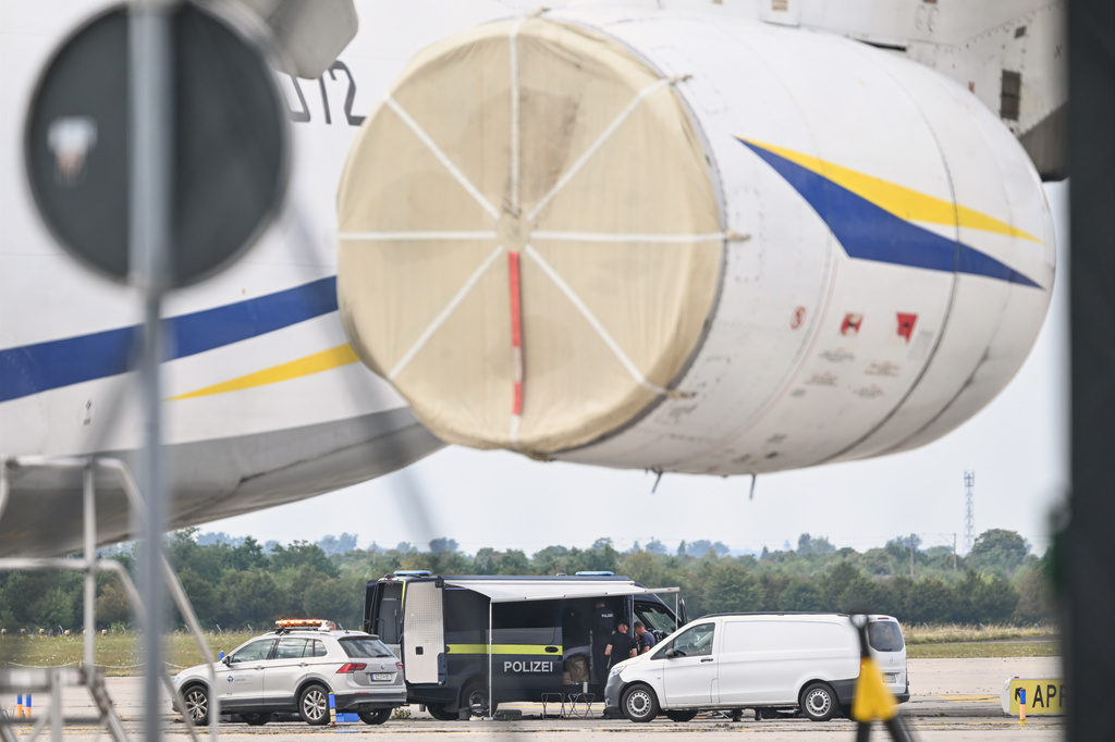 Police forensic technicians work near a Ukrainian aircraft at Leipzig/Halle Airport, where a drone with an explosive device was found and a detonator was removed from the object, in Schkeuditz, Germany, Wednesday Aug. 5, 2026. (Hendrik Schmidt/dpa via AP)