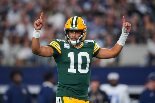 Green Bay Packers' Jordan Love (10) celebrates a touchdown run by Josh Jacobs (8) in the second half of an NFL football game against the Dallas Cowboys Sunday, Sept. 28, 2025, in Arlington, Texas. (AP Photo/Julio Cortez) Green Bay Packers' Jordan Love (10) celebrates a touchdown run by Josh Jacobs (8) in the second half of an NFL football game against the Dallas Cowboys Sunday, Sept. 28, 2025, in Arlington, Texas. (AP Photo/Julio Cortez)