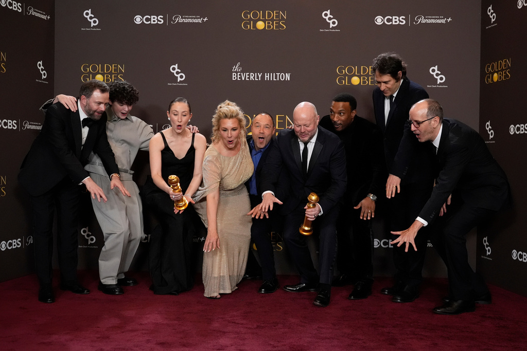 Philip Barantini, from left, Owen Cooper, Erin Doherty, Hannah Walters, Stephen Graham, Andy Cooper, Ashley Walters, Jeremy Kleiner, and Jack Thorne pose in the press room with the award for best television limited series, anthology series or motion picture made for television for "Adolescence" during the 83rd Golden Globes on Sunday, Jan. 11, 2026, at the Beverly Hilton in Beverly Hills, Calif. (AP Photo/Chris Pizzello)