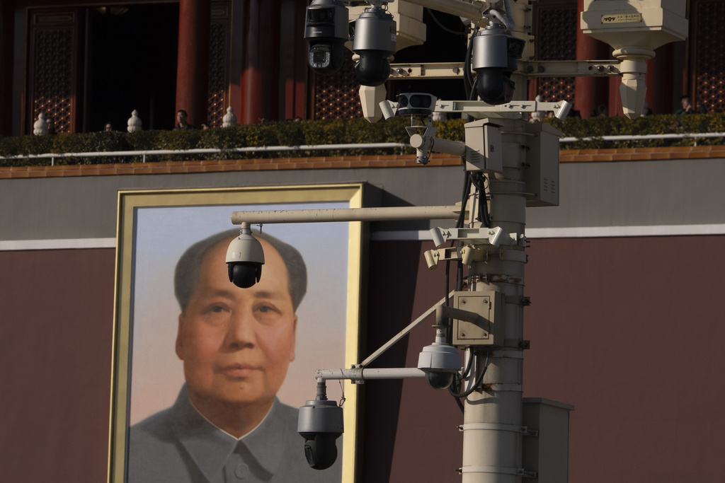 Security cameras are seen by a portrait of late Chinese leader Mao Zedong near Tiananmen Gate in Beijing, Tuesday, Feb. 18, 2025. (AP Photo/Ng Han Guan)
