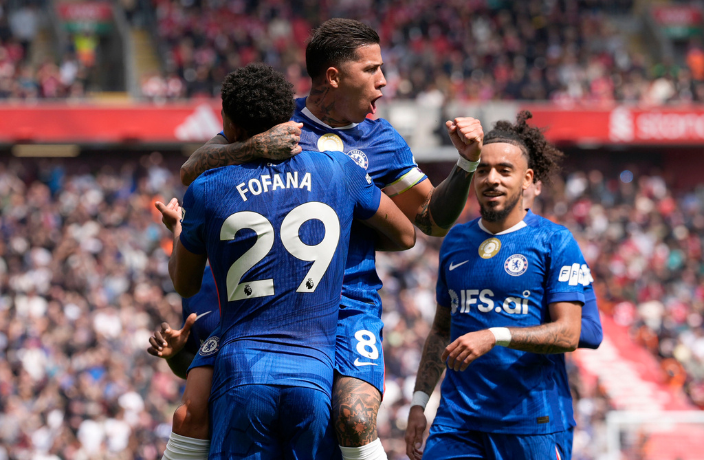 Chelsea's Enzo Fernandez (top) celebrates with team-mate Wesley Fofana after scoring their side's first goal of the game during the Premier League soccer match between Liverpool and Chelsea in Liverpool, England, Saturday, May 9, 2026. (Peter Byrne/PA via AP)