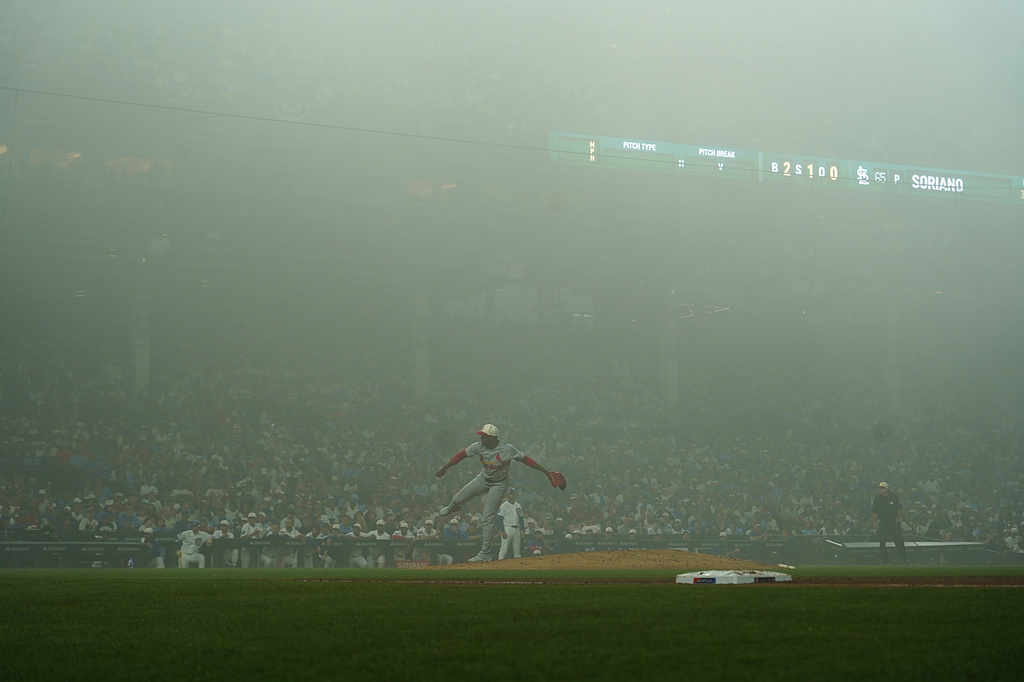 St. Louis Cardinals pitcher Kyle Leahy throws the ball in the fog against the Chicago Cubs during the sixth inning of a baseball game Saturday, July 4, 2026, in Chicago. (AP Photo/David Banks)