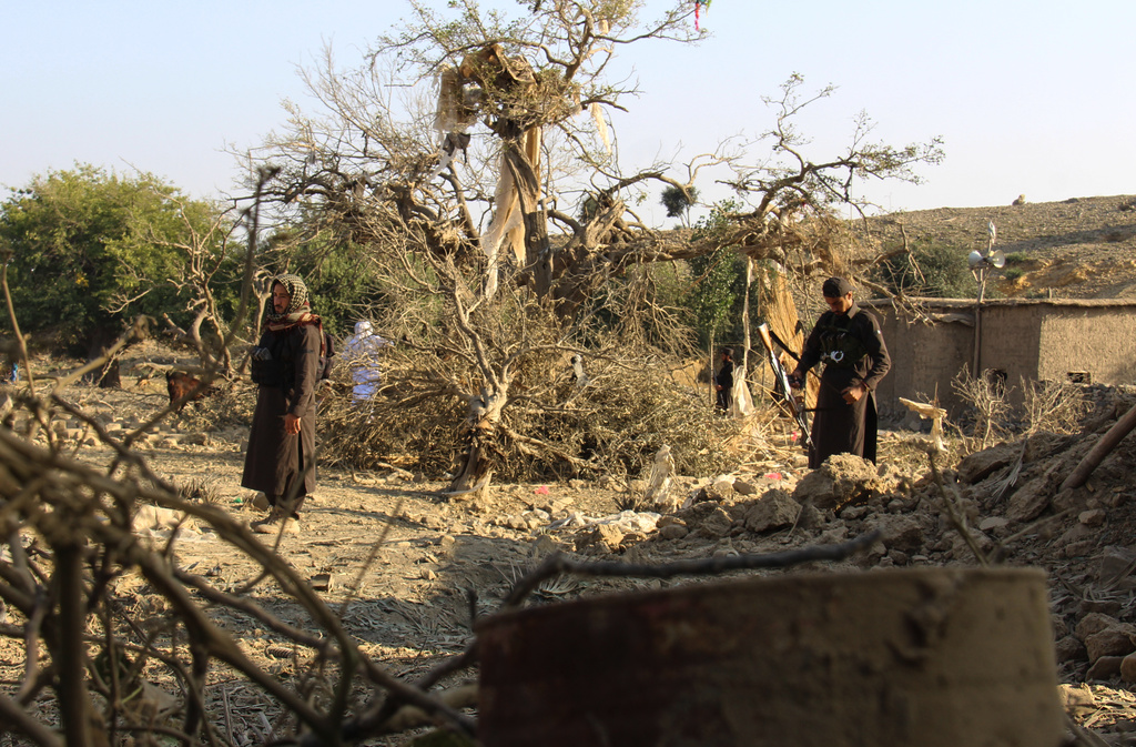 Taliban security officers inspect the scene of what Taliban officials said were Pakistani airstrikes in Khost province, Afghanistan, Thursday, Sept. 24, 2026. (AP Photo/Saifullah Zahir)