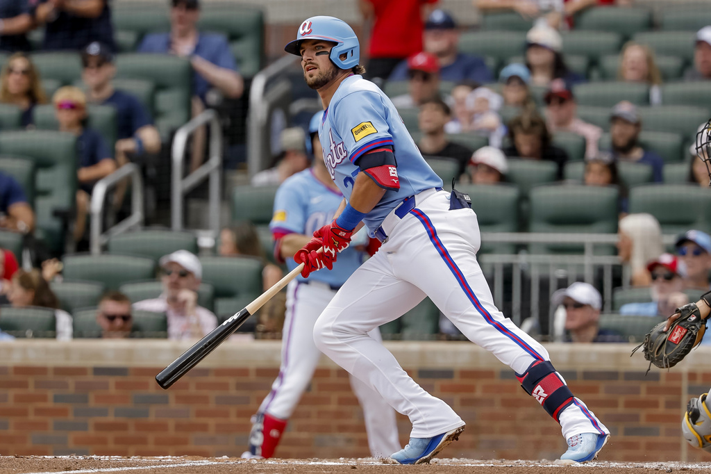Atlanta Braves' Austin Riley hits an RBI double against the Pittsburgh Pirates during the first inning of a baseball game, Saturday, June 6, 2026, in Atlanta. (AP Photo/Erik S. Lesser)