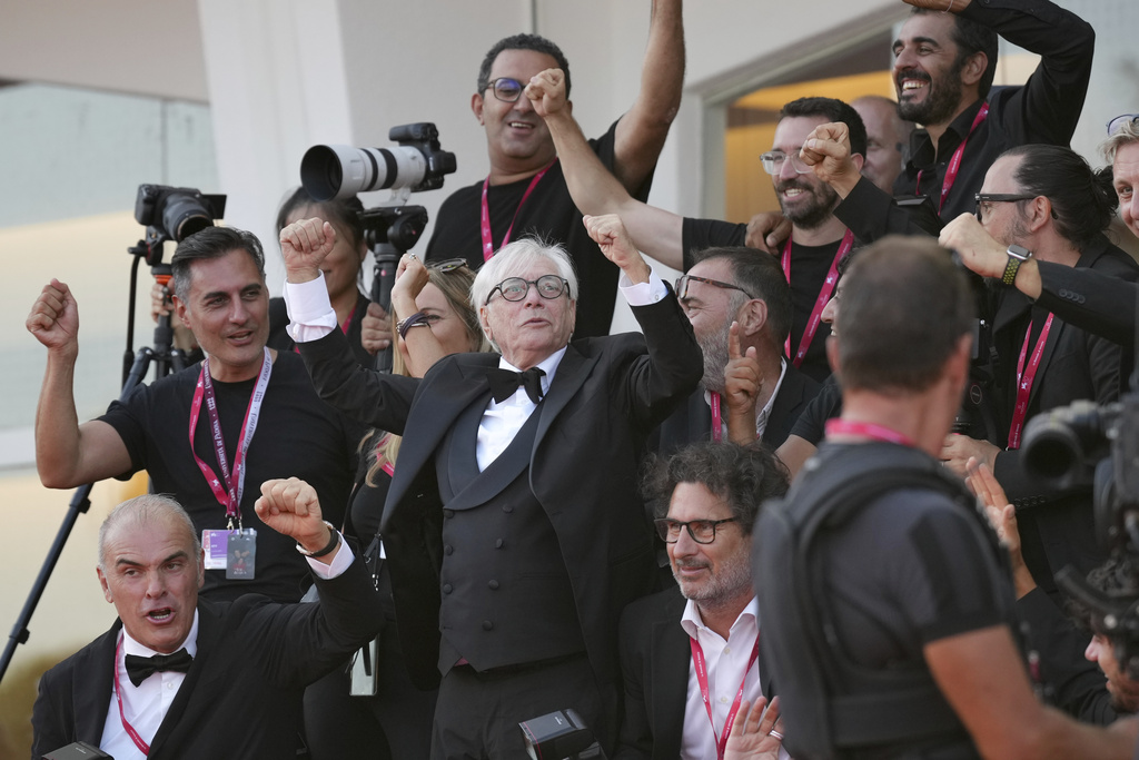 Nino D'Angelo poses with photographers during the red carpet for the film 'The Sun Rises on Us All' at the 82nd edition of the Venice Film Festival in Venice, Italy, on Friday, Sept. 5, 2025. (Photo by Alessandra Tarantino/Invision/AP)