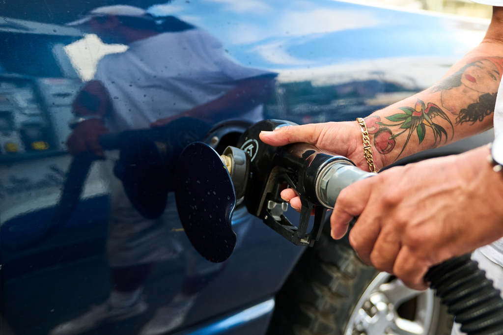 A motorist fills up his truck for over a $100 at a gas station in Los Angeles on Friday, April 17, 2026. (AP Photo/Damian Dovarganes)