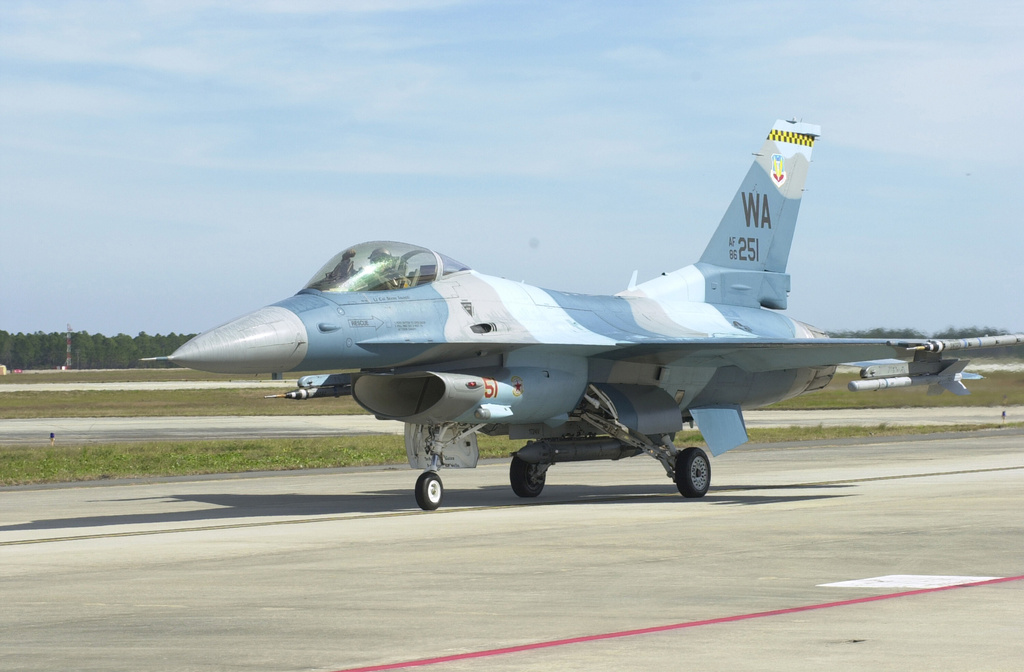 FILE- An F-16 Fighting Falcon returns from a mission at Tyndall Air Force Base, Fla., in this Nov. 16, 2004 file photo. (AP Photo/Bill Kaczor, File)