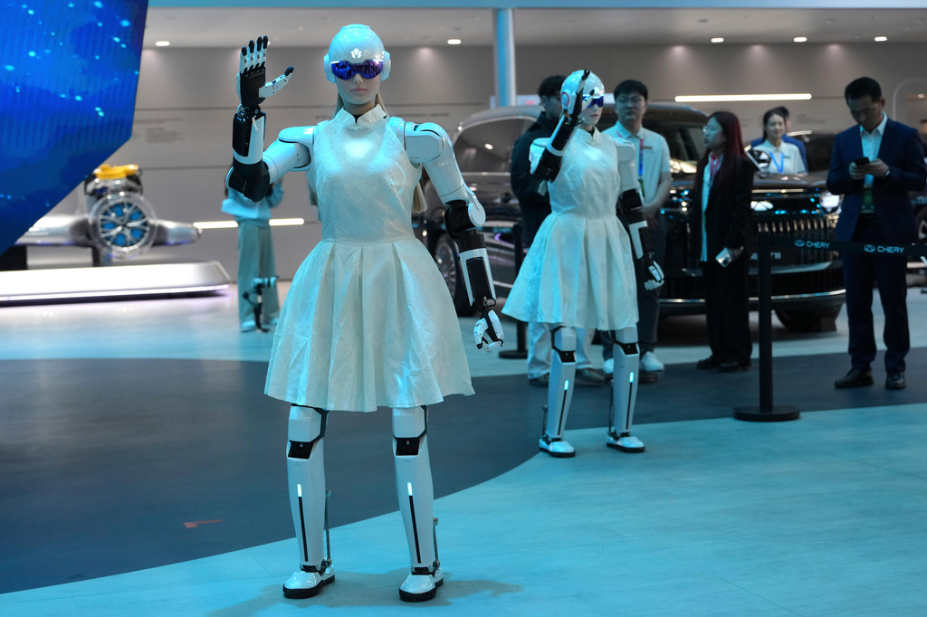 Robots entertain attendees during Auto China 2026 in Beijing, Friday, April 24, 2026. (AP Photo/Ng Han Guan)