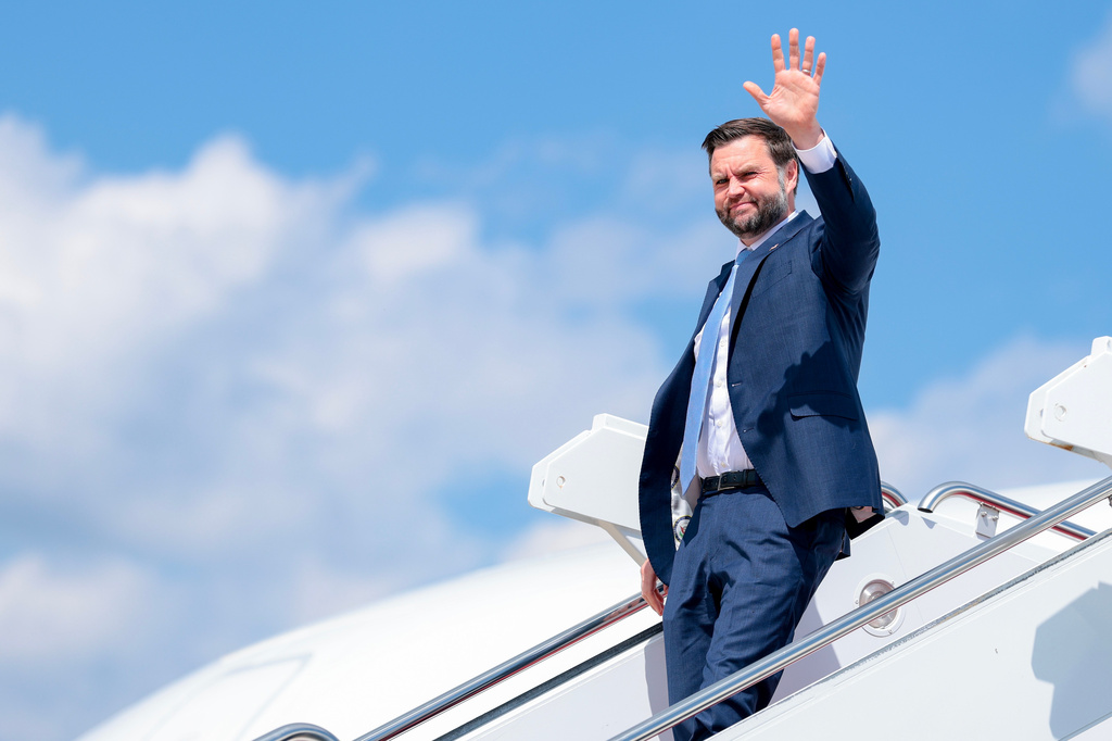 Vice President JD Vance waves as he disembarks Air Force Two at Joint Base Andrews, Md., following a trip to Maine, Monday, Aug. 24, 2026. (Anna Moneymaker/Pool Photo via AP )