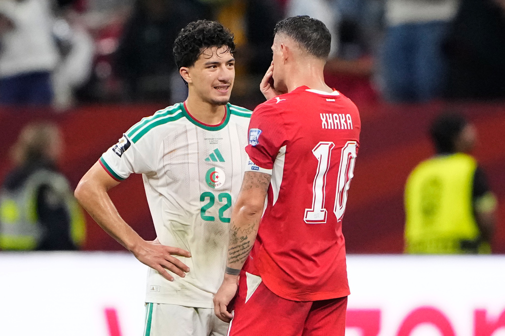 Switzerland's Granit Xhaka (10) and Algeria's Ibrahim Maza (22) talk following during the World Cup round of 32 soccer match between Switzerland and Algeria in Vancouver, British Columbia, Thursday, July 2, 2026. (AP Photo/Lindsey Wasson)