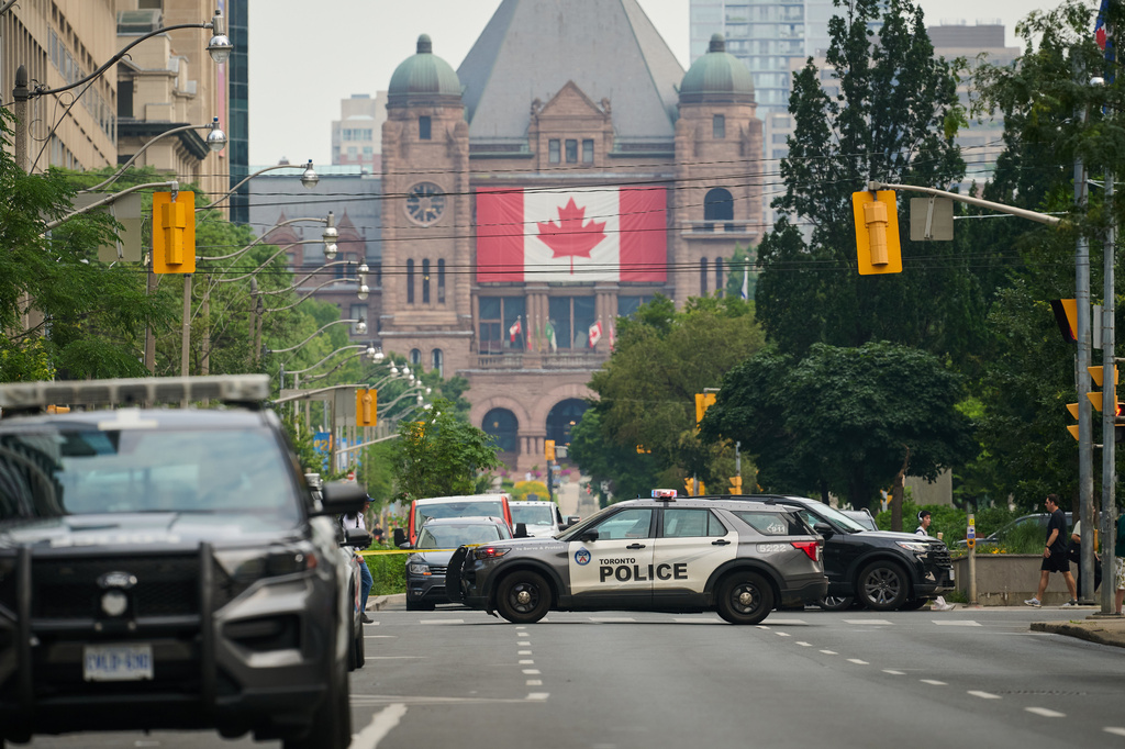 Police work the scene of an early morning shooting outside the US Consulate in Toronto, on Monday, July 27, 2026. (Sammy Kogan/The Canadian Press via AP)