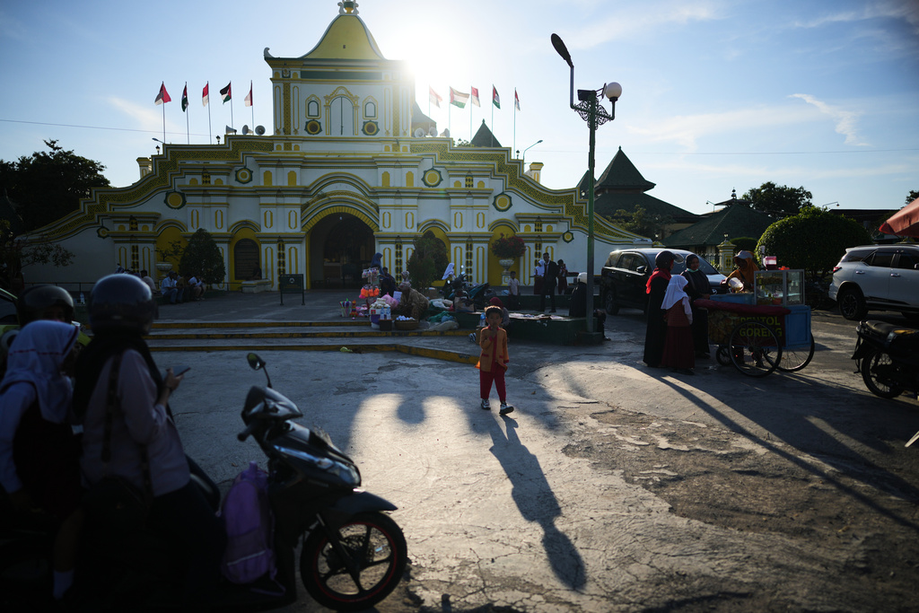 A young boy stands outside Sumenep grand Mosque, in Sumenep on Madura Island, Indonesia, Monday, Sept. 8, 2025. (AP Photo/Dita Alangkara)