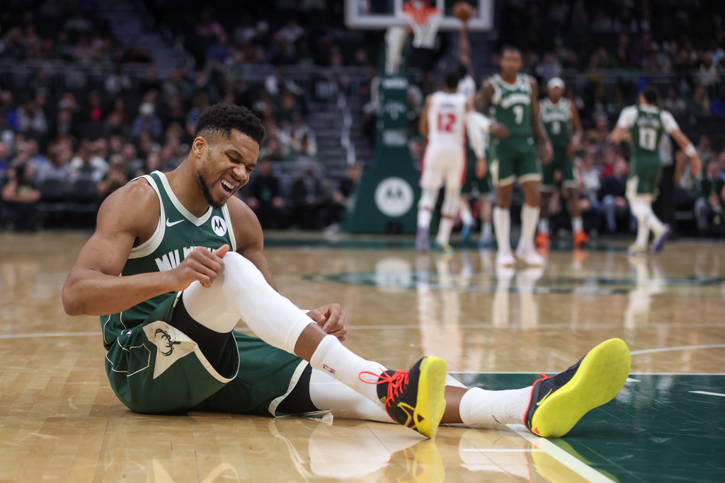 FILE - Milwaukee Bucks' Giannis Antetokounmpo reacts after suffering an injury during the first half an NBA basketball game against the Detroit Pistons, Wednesday, Dec. 3, 2025, in Milwaukee. (AP Photo/Kylie Bridenhagen, File)