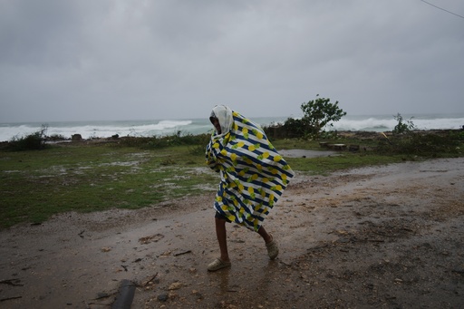 A man walks in the rain before the arrival of Hurricane Melissa in Canizo, a village in Santiago de Cuba, Tuesday, Oct. 28, 2025. (AP Photo/Ramón Espinosa) A man walks in the rain before the arrival of Hurricane Melissa in Canizo, a village in Santiago de Cuba, Tuesday, Oct. 28, 2025. (AP Photo/Ramón Espinosa)