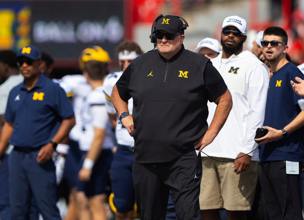 FILE - Michigan acting head coach Biff Poggi watches as his team plays against Nebraska during the first half of an NCAA college football game Saturday, Sept. 20, 2025, in Lincoln, Neb. (AP Photo/Rebecca S. Gratz, File)