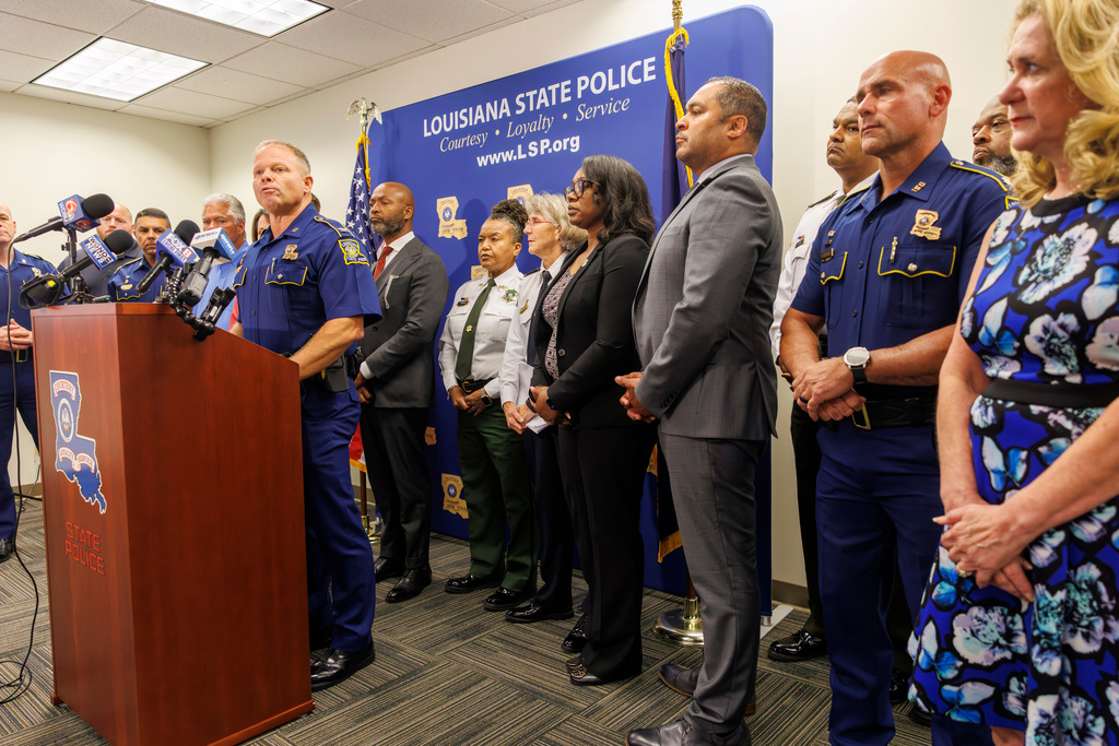 Louisiana State Police Col. Robert Hodges, left, speaks at a news conference about the arrest of Derrick Groves, the last of several inmates caught after breaking out of prison months ago, in New Orleans, Wednesday, Oct. 8, 2025. (Chris Granger/The Times-Picayune/The New Orleans Advocate via AP)