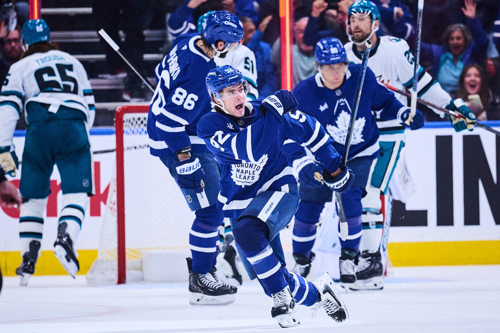 Toronto Maple Leafs' Gavin McKenna (92) celebrates after scoring against the San Jose Sharks during the third period of an NHL hockey game in Toronto, on Monday, Oct. 19, 2026. (Sammy Kogan/The Canadian Press via AP)