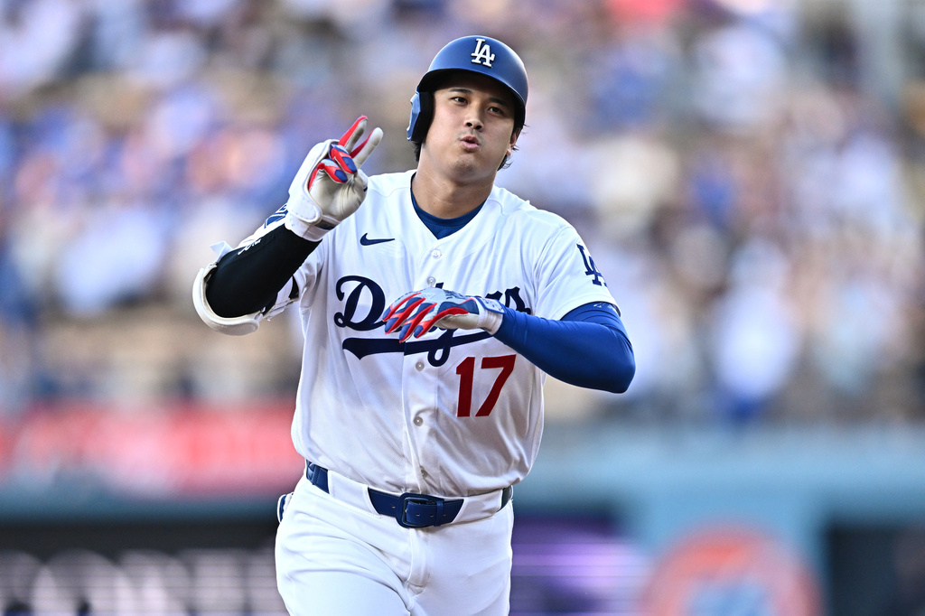 Los Angeles Dodgers' Shohei Ohtani gestures after hitting a home run during the first inning of a baseball game against the Arizona Diamondbacks, Friday, July 10, 2026, in Los Angeles. (AP Photo/William Liang)