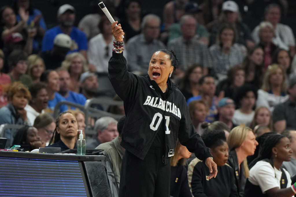 South Carolina head coach Dawn Staley motions towards the court during the first half of the women's National Championship Final Four NCAA college basketball tournament game against UCLA, Sunday, April 5, 2026, in Phoenix. (AP Photo/Rick Scuteri)