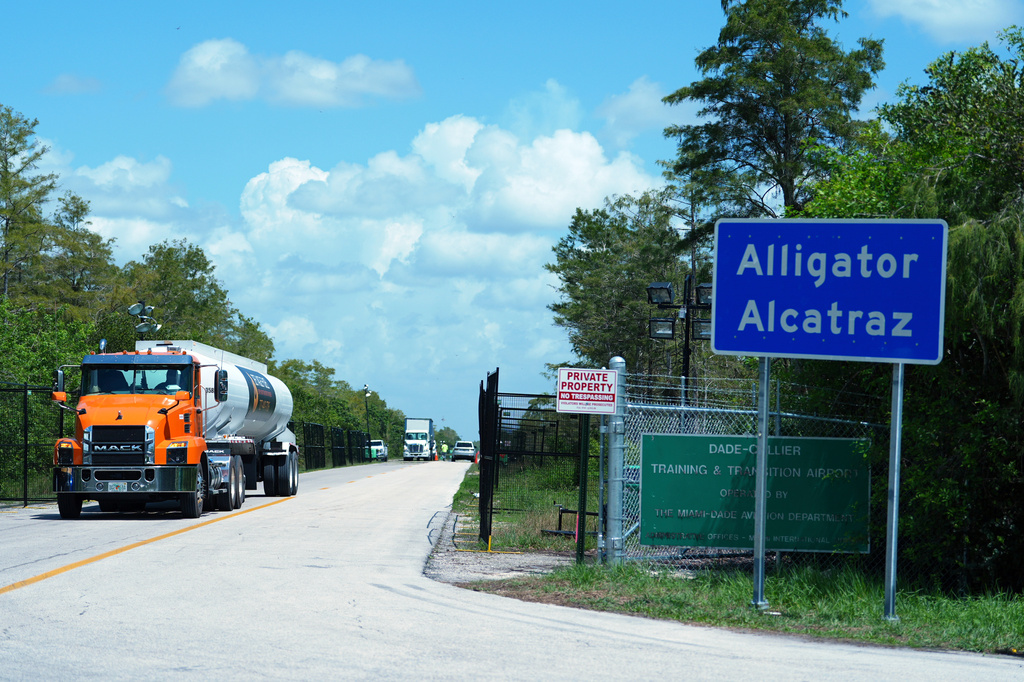 FILE - Trucks come and go from the "Alligator Alcatraz" immigration detention center in the Florida Everglades, Aug. 28, 2025, in Collier County, Fla. (AP Photo/Rebecca Blackwell, File)
