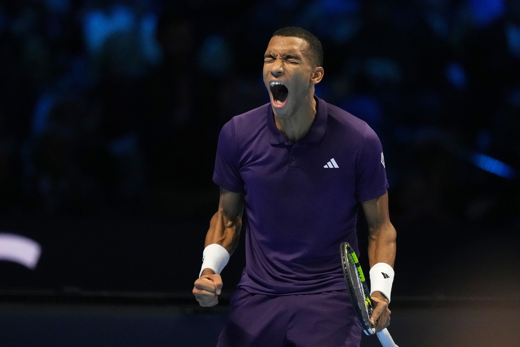 Canada's Felix Auger-Aliassime celebrates after winning against United States' Ben Shelton during their tennis match of the ATP World Tour Finals, in Turin, Italy, Wednesday, Nov. 12, 2025. (AP Photo/Antonio Calanni)