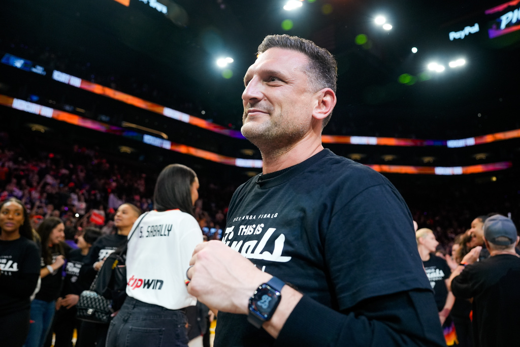 Phoenix Mercury Head Coach Nate Tibbetts walks around the court after winning Game 4 of a WNBA basketball playoff semifinals series against the Minnesota Lynx, Sunday, Sept. 28, 2025, in Phoenix. (AP Photo/Samantha Chow)